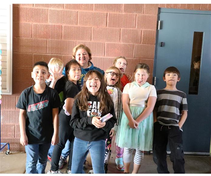 Image of Ruthie Contreras smiling with a group of students